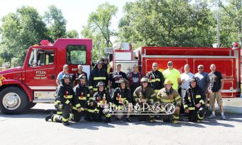 Firemen water fight draws large crowd