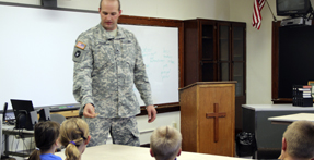 Sergeant Blaine Collins talks  to St. Paul’s Lutheran School students